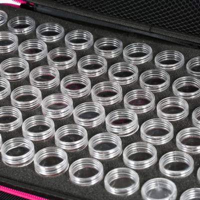 Sorting case, black case with purple rim, contents 60 screw cap jars.